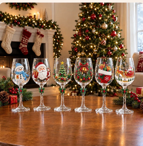 All six Christmas glass designs standing in a row by the tree