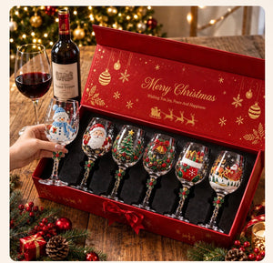 Lifting the Snowman glass from the open red Merry Christmas gift box